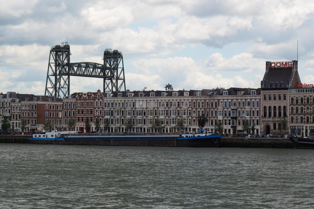 Historic Rotterdam Lift Bridge and Waterfront Architecture - Dutch cityscape with iconic lift bridge, Maas River, and townhouses