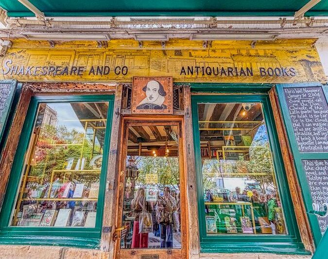 Historic entrance of Shakespeare and Company bookstore in Paris, showcasing its antiquarian charm
