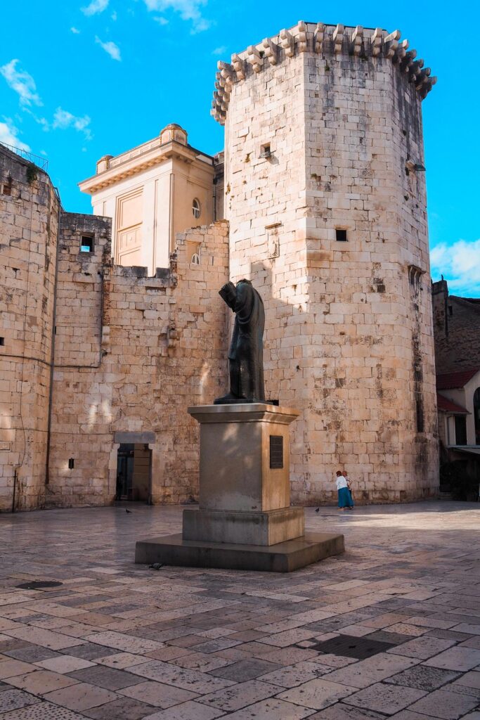 Statue in Old Town Split, Croatia - Historic Mediterranean landmark amidst ancient architecture