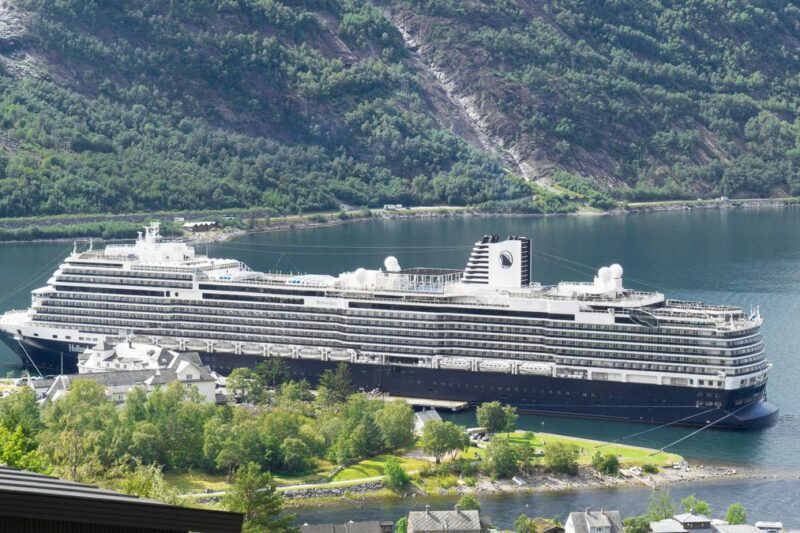 Holland America cruise ship docked in Eidfjord, Norway, stunning fjord landscape in background