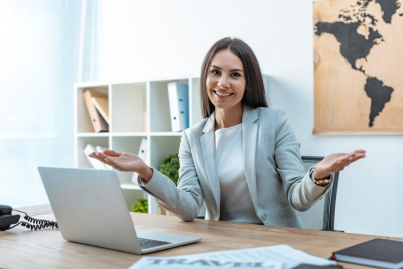 Smiling Travel Agent Working at Home