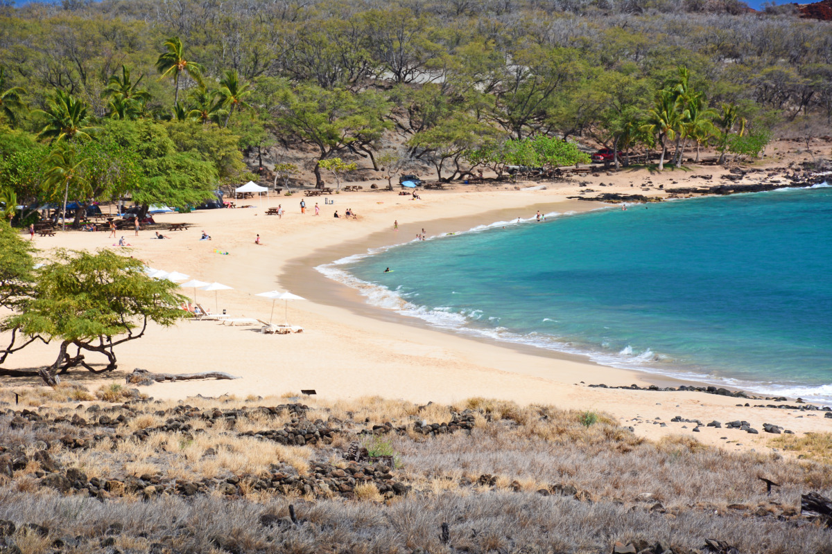 Beach with tourists in Hulopoe Bay on Lanai Island in Hawaii