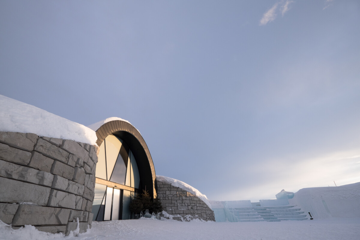Outdoor seating and snowy grounds near ICEHOTEL in Jukkasjärvi