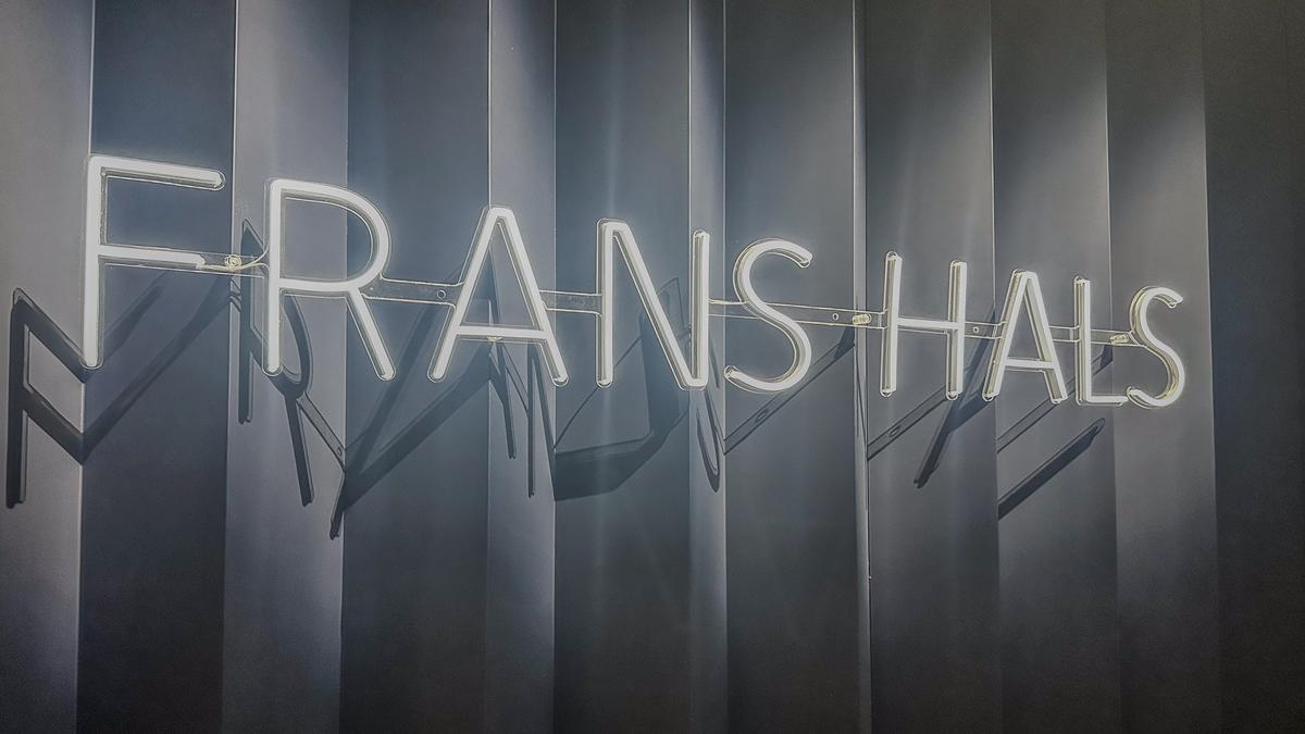 Neon-lit 'FRANS HALS' sign at the Rijksmuseum in Amsterdam