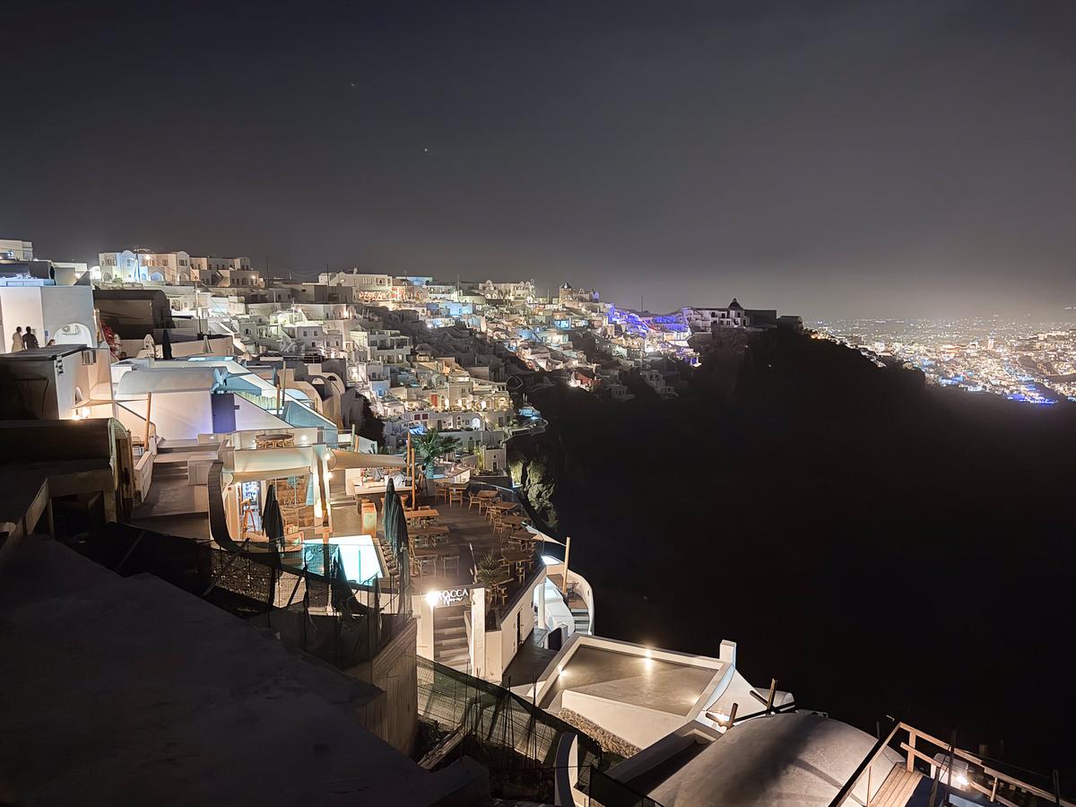 Gorgeous night view of Imerovigli, Santorini with Aegean Sea backdrop on a picturesque Greek island