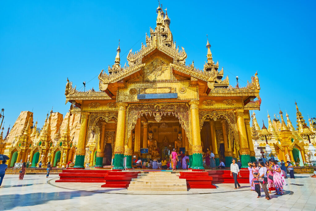 Kakusandha Buddha and visitors exploring in Shwedagon Pagoda, Myanmar