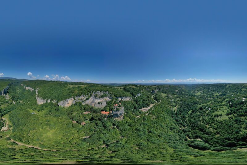 Breathtaking 360 panoramic view of Katskhi, lush green landscapes, historical monastery - Adobe Stock