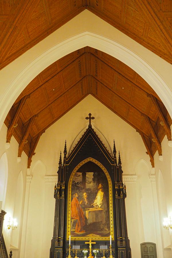 Kristiansand Cathedral interior with grand altar and ornate wooden ceiling, Norway