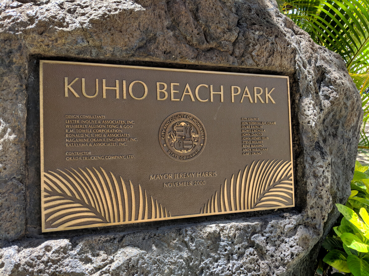 Kuhio Beach Park Sign with City and County of Honolulu State of Hawaii Seal on Rock Wall
