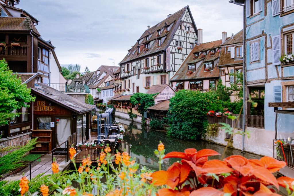 Historic houses, flowers, and canal view at La Petite Venise in Colmar, Alsace, France