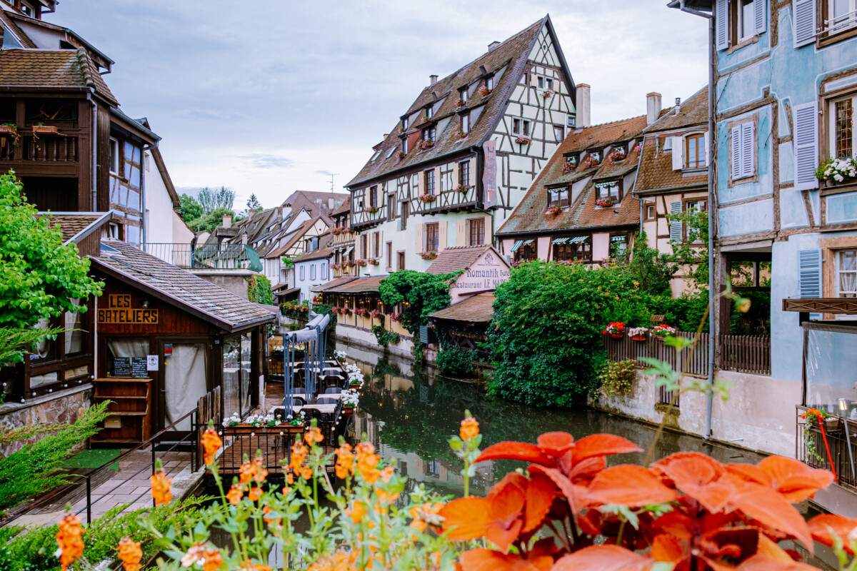 Historic houses, flowers, and canal view at La Petite Venise in Colmar, Alsace, France