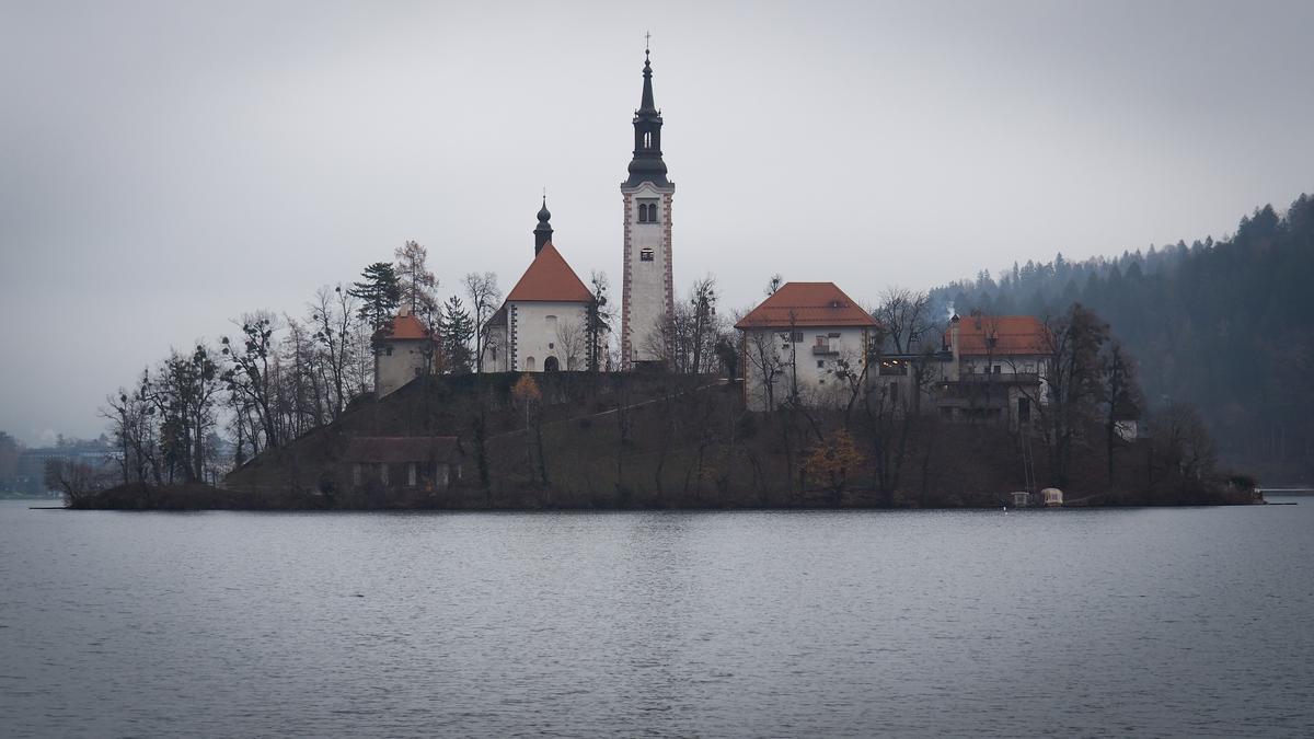 Lake Bled, Slovenia island church surrounded by serene waters and lush green scenery