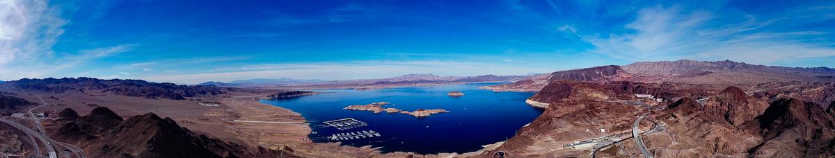 Aerial panorama of Lake Mead with surrounding desert landscape and clear blue skies