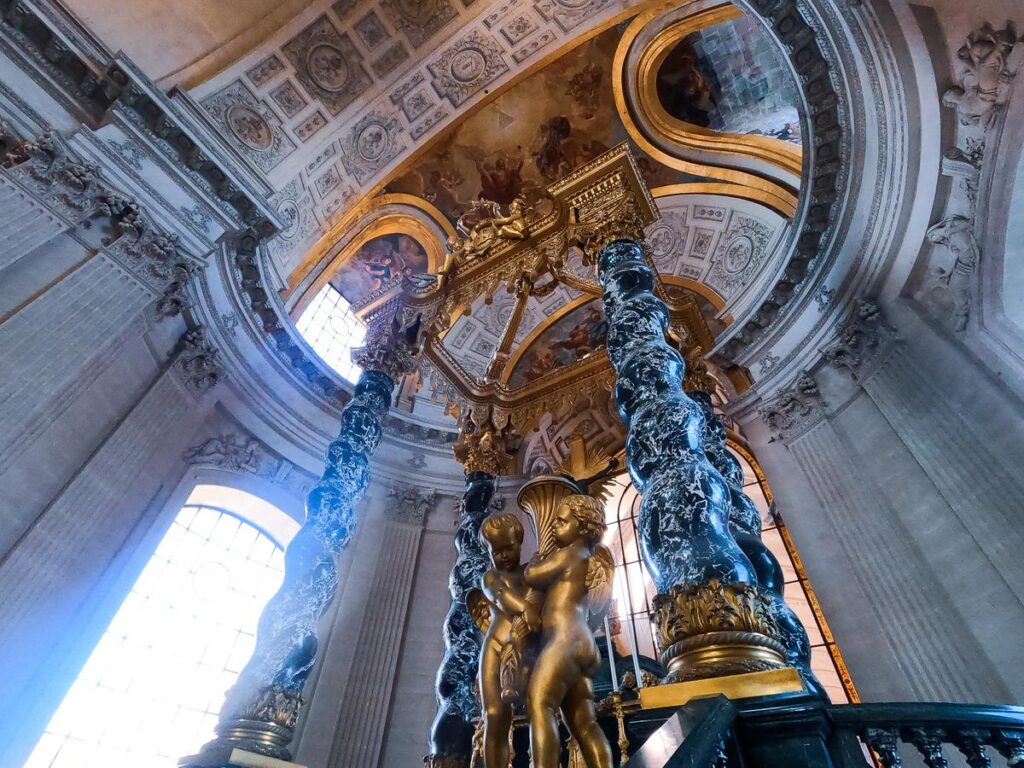 Sunlight illuminates Les Invalides interior with ornate details