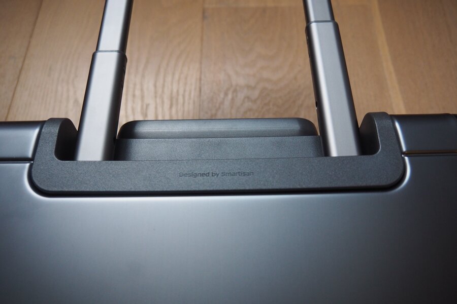 The extended telescopic handle rises above the top grip of the LEVEL8 Gibraltar carry-on.