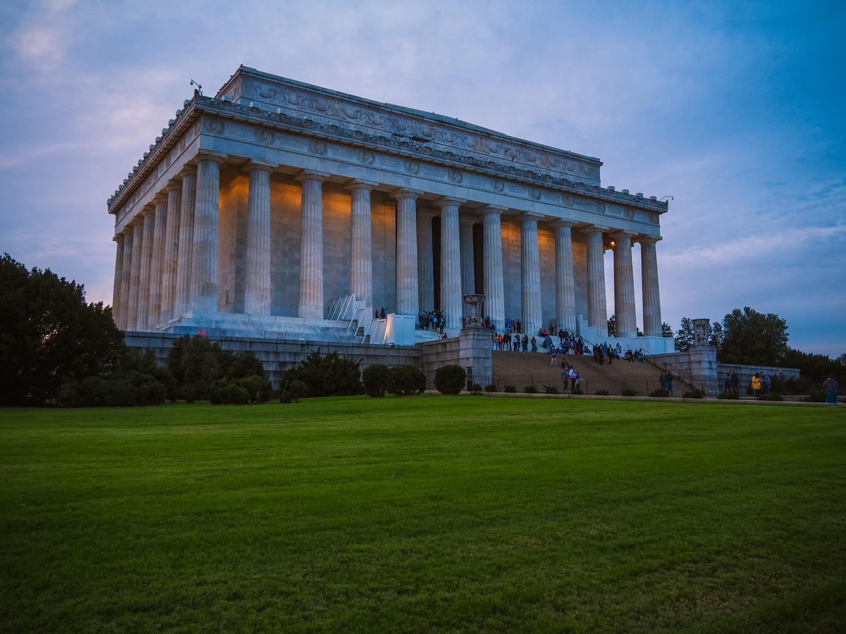 Twilight view of Lincoln Memorial in Washington, D.C. with tourists