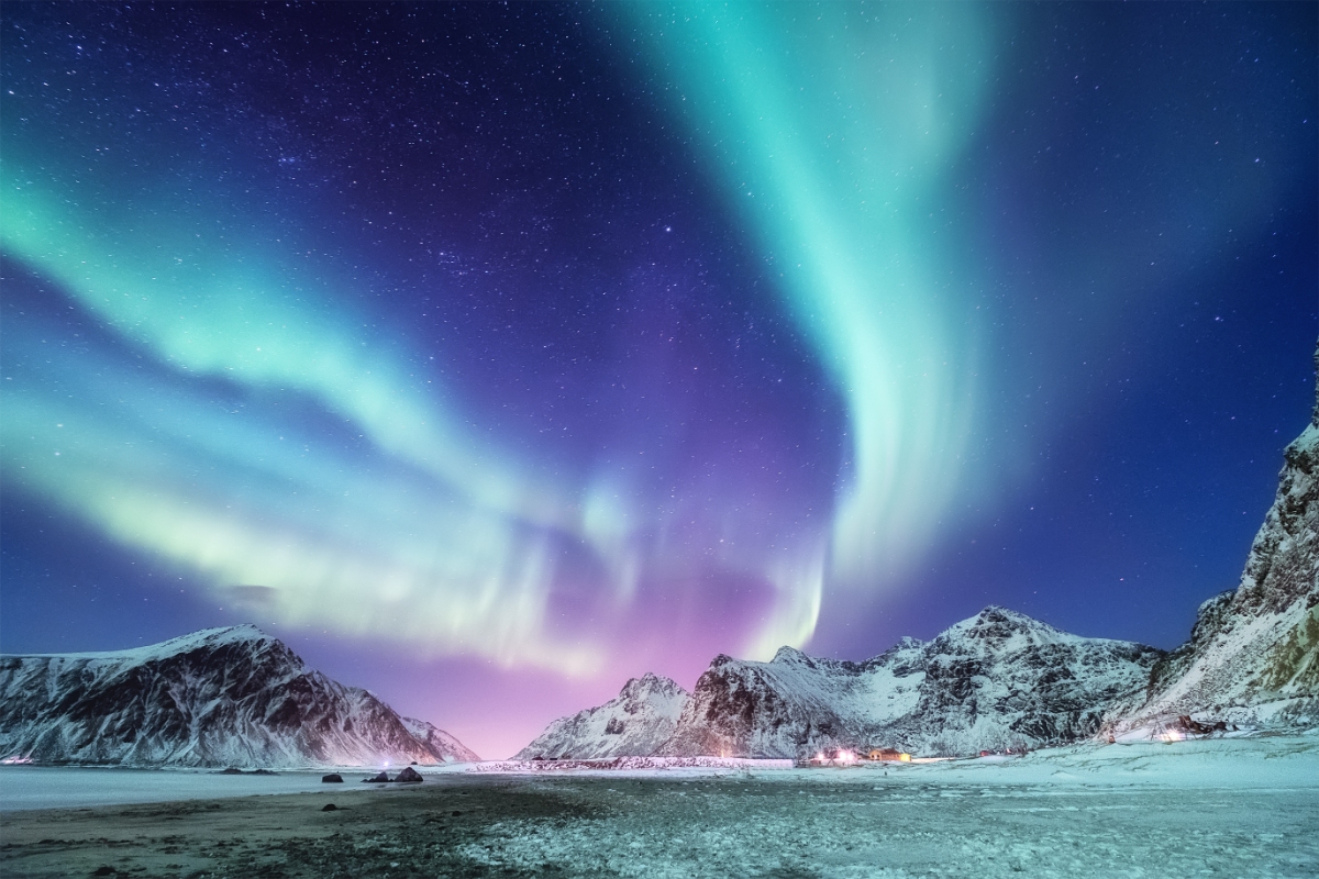 Northern Lights over the mountains at Lofoten Islands in Norway