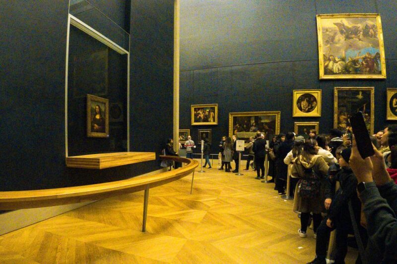 Visitors at Louvre admiring Leonardo's Mona Lisa
