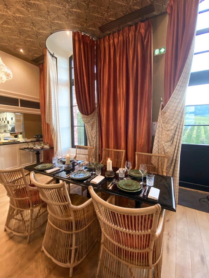 Luxury dining at Chateau de Sacy Restaurant: elegant table setting, fine dining ambiance, France's romantic countryside.