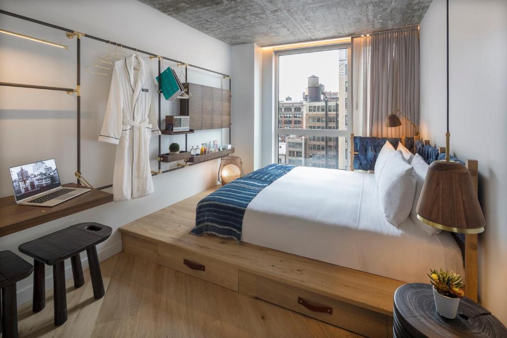Wood-accented guest room at MADE Hotel in New York's NoMad neighborhood