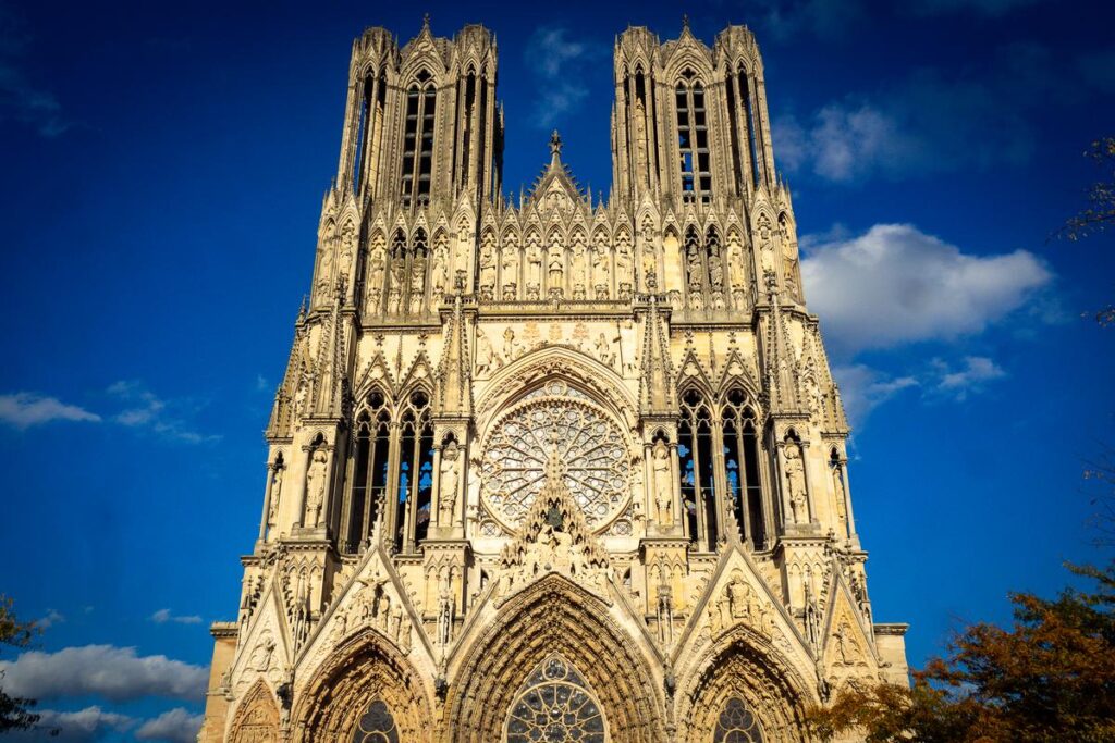 Reims Cathedral, French Gothic architecture, UNESCO World Heritage site against blue sky