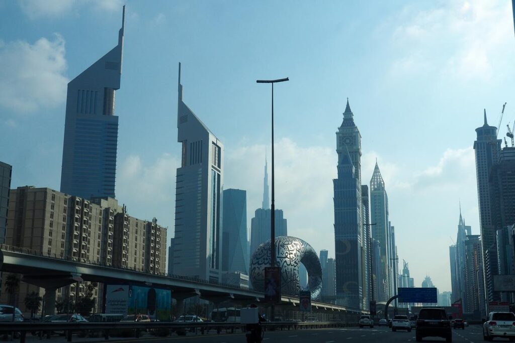 High-resolution Dubai skyline view from Sheikh Zayed Road, featuring modern architectural marvels and the Museum of the Future.