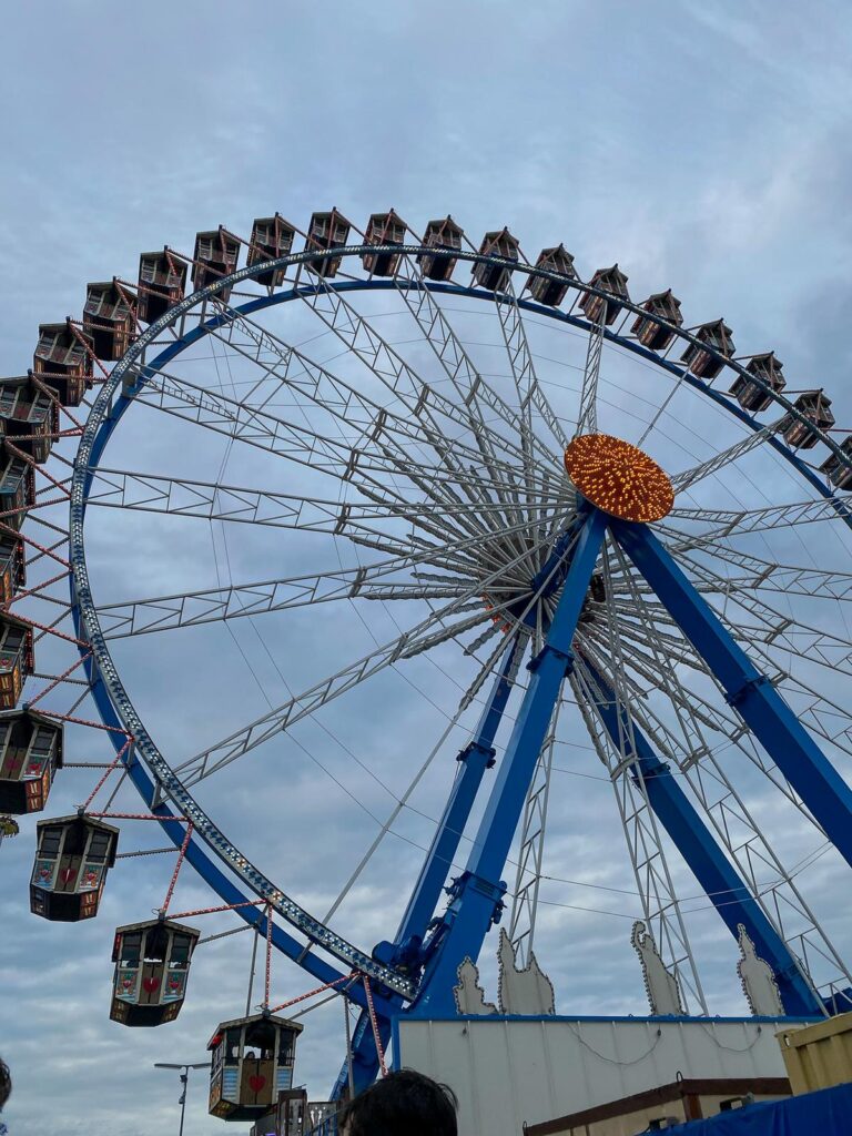 Iconic Ferris wheel at Oktoberfest Munich, offering panoramic views and festival atmosphere.