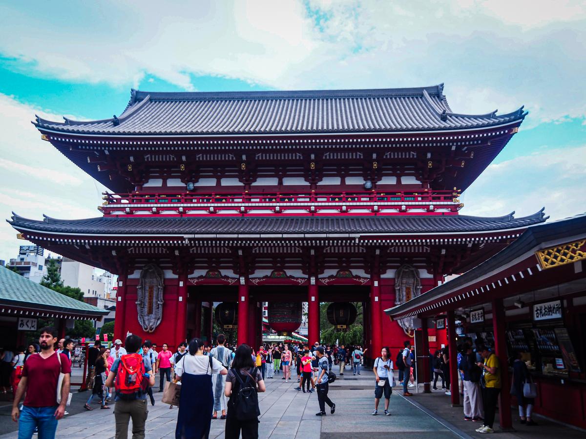 Hōzōmon Gate at Senso-Ji Temple, Asakusa, Tokyo, Japan - Tourists and Pilgrims Explore Historic Buddhist Landmark