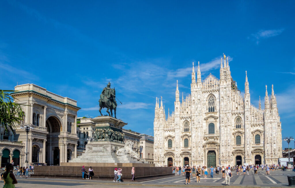 Milan Cathedral Square with the view of Milan Cathedral and the Vittorio Emanuele II equestrian statue in Milan, Italy
