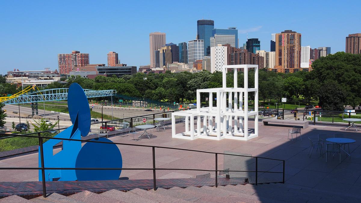 Minneapolis skyline view from Walker Art Center rooftop, showcasing urban architecture and greenery.