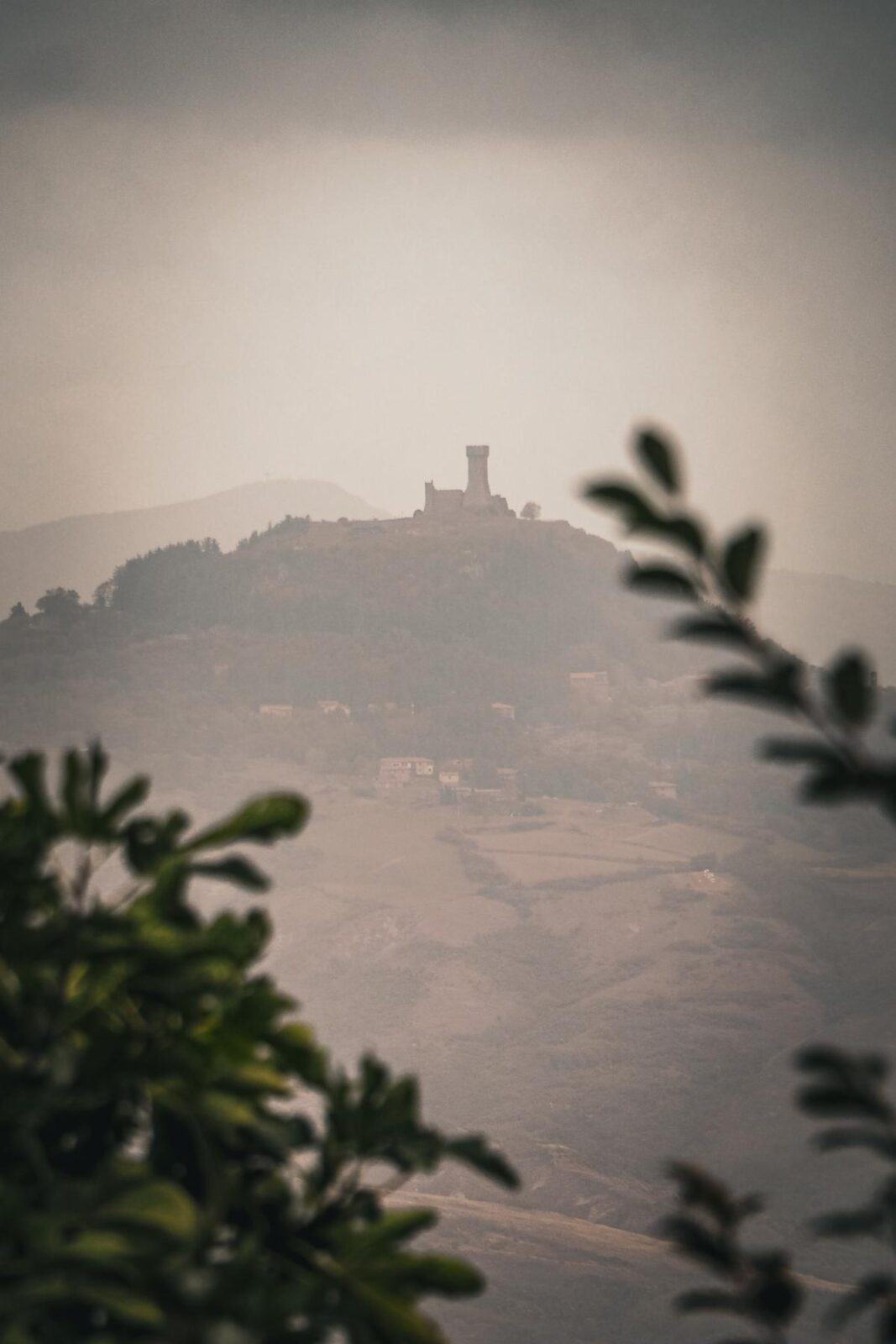 Misty mountain castle near Abbadia San Salvatore, Italy