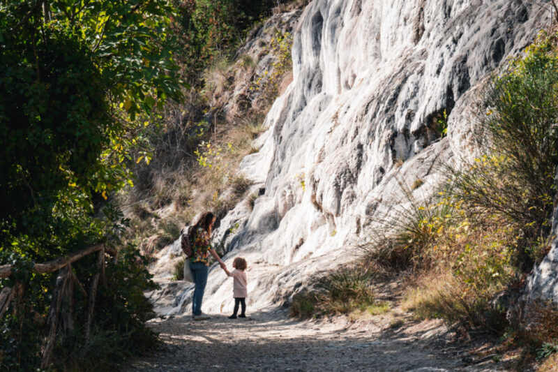 Alex Kroeger, contributor of ViaTravelers, hiking in Italy with Toddler Daughter