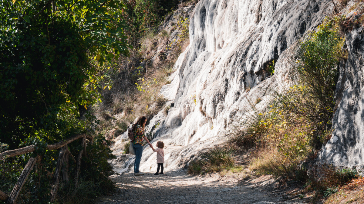 Alex Kroeger, contributor of ViaTravelers, hiking in Italy with Toddler Daughter