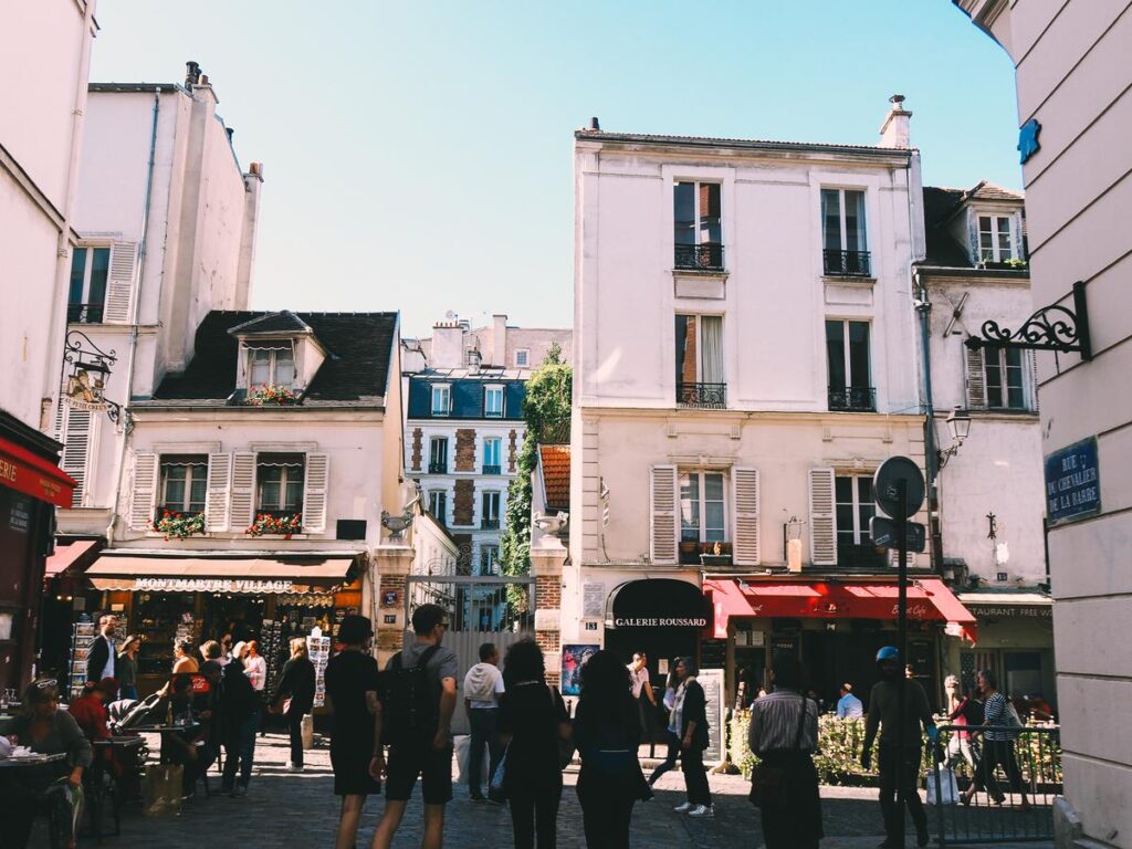 Sunny day on charming Rue De Chevalier de la Barre in Montmartre, Paris