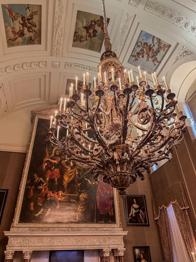 Chandelier and ceiling paintings in the Moses Room at Royal Palace Amsterdam