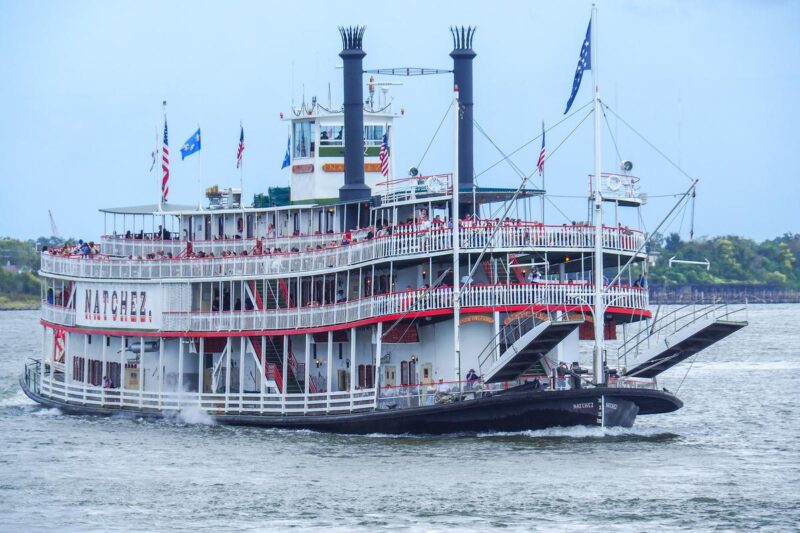 Steamboat Natchez cruising Mississippi River New Orleans with paddlewheel design