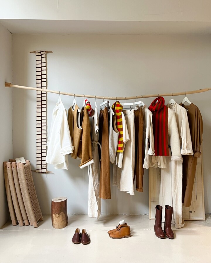 Neutral clothing rack display at rustic boutique shops in Amsterdam.