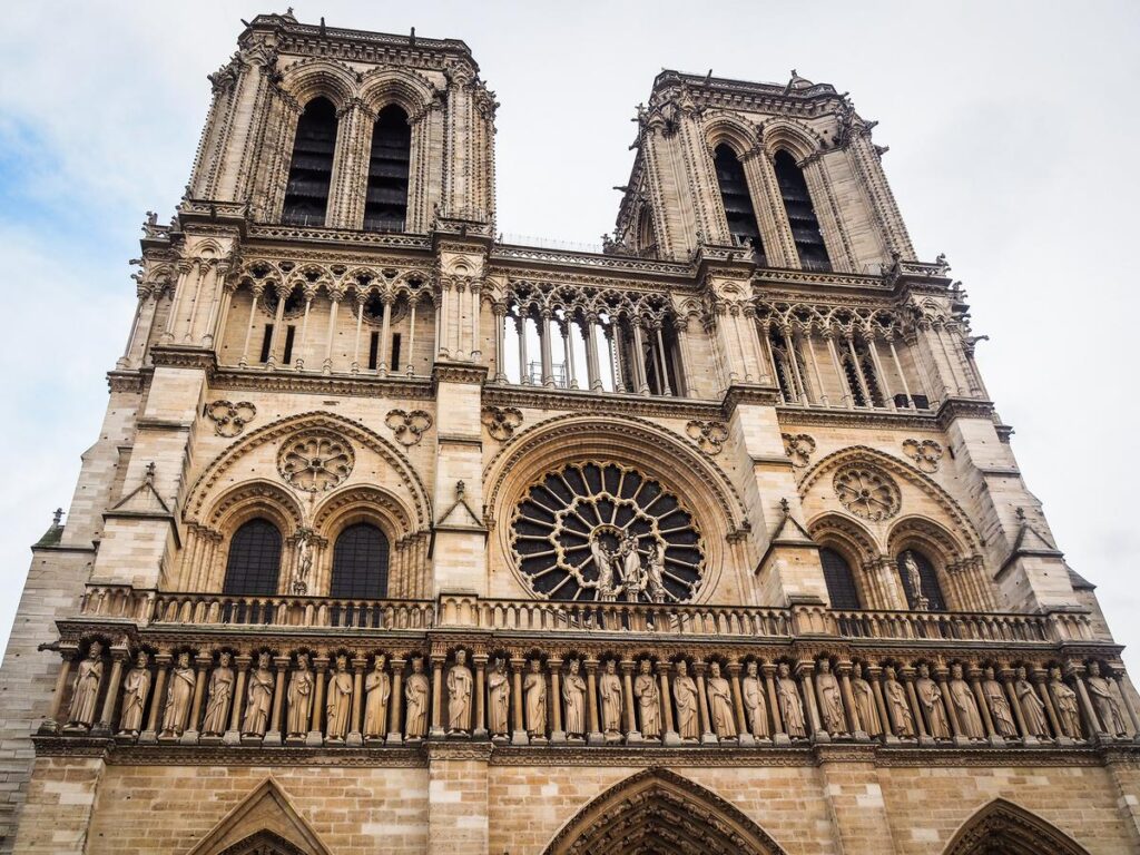 Notre Dame Cathedral Gothic facade with twin towers and rose window in Paris