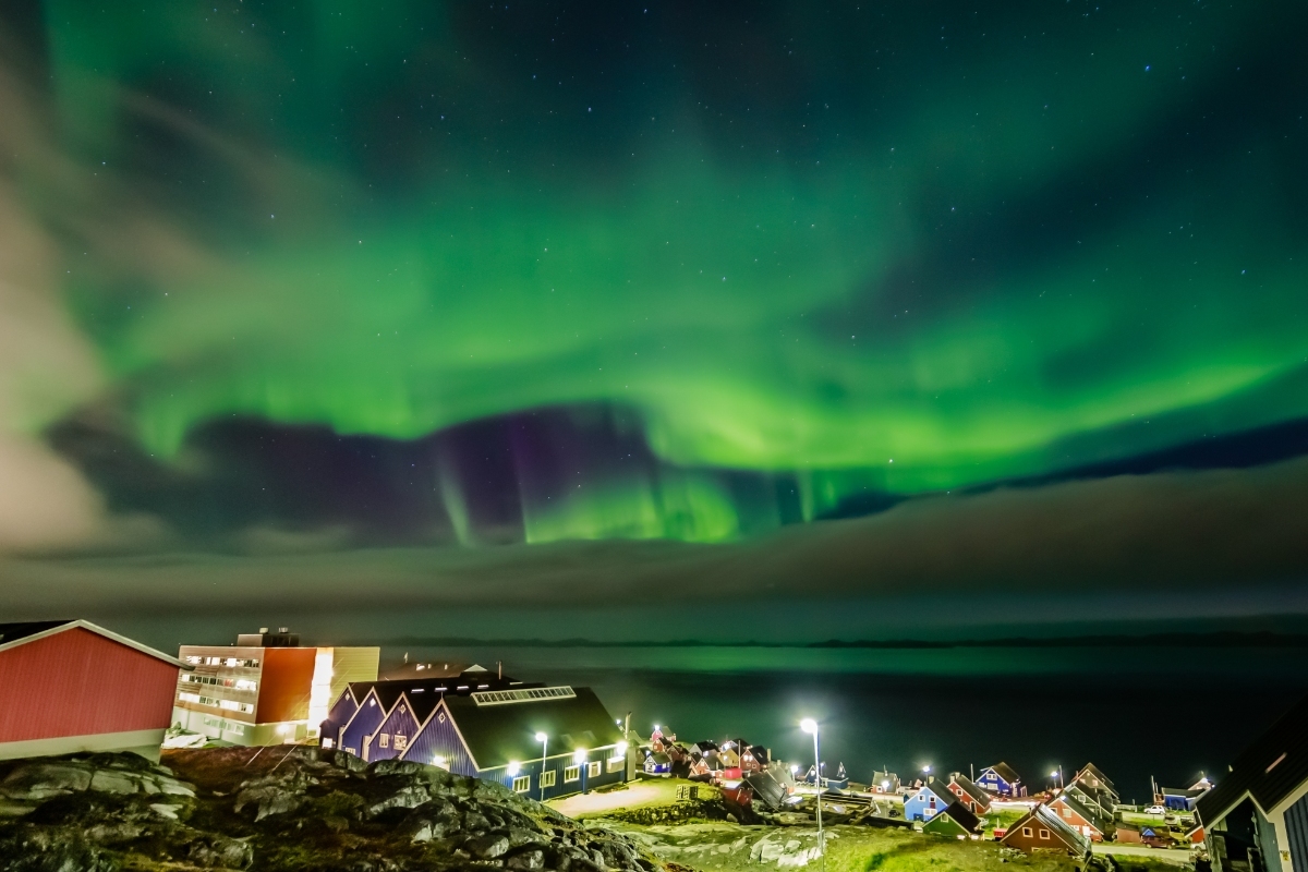 Northern Lights over the Inuit village at the fjord, Nuuk, Greenland