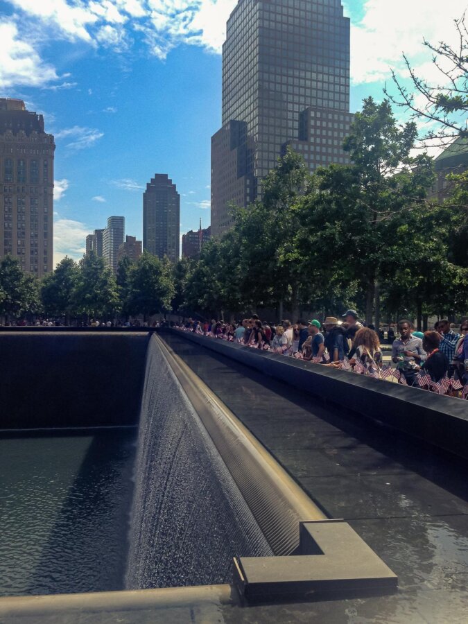 Visitors at 9/11 Memorial reflection pools, NYC