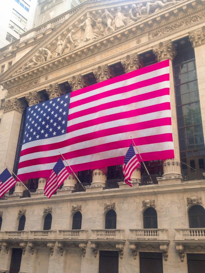 NYSE with US flag symbolizing American pride on Wall Street