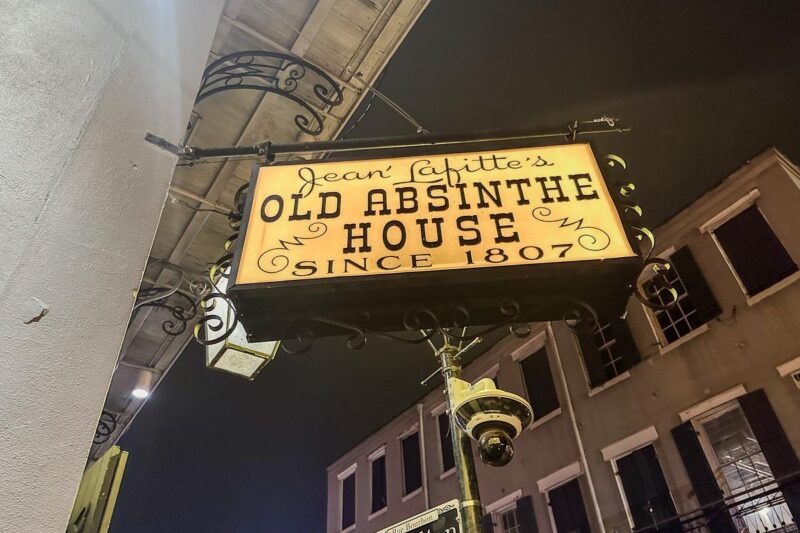 Old Absinthe House sign in New Orleans French Quarter, historic bar established in 1807