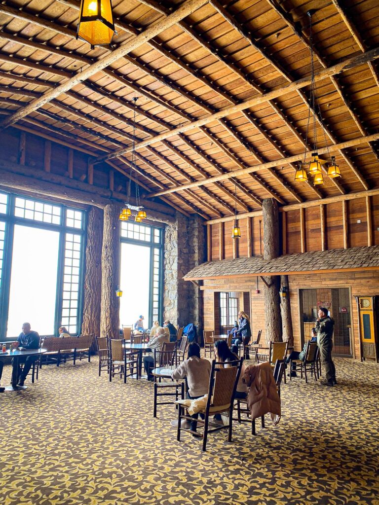 Old Faithful Inn dining room with rustic charm and spacious interior in Yellowstone National Park