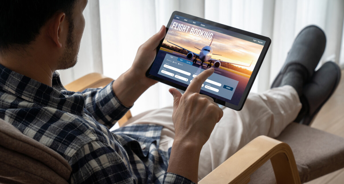 Man searching and booking a flight online