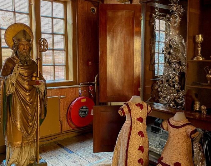 17th-century ecclesiastical artifacts and period clothing display in Amsterdam's clandestine museum