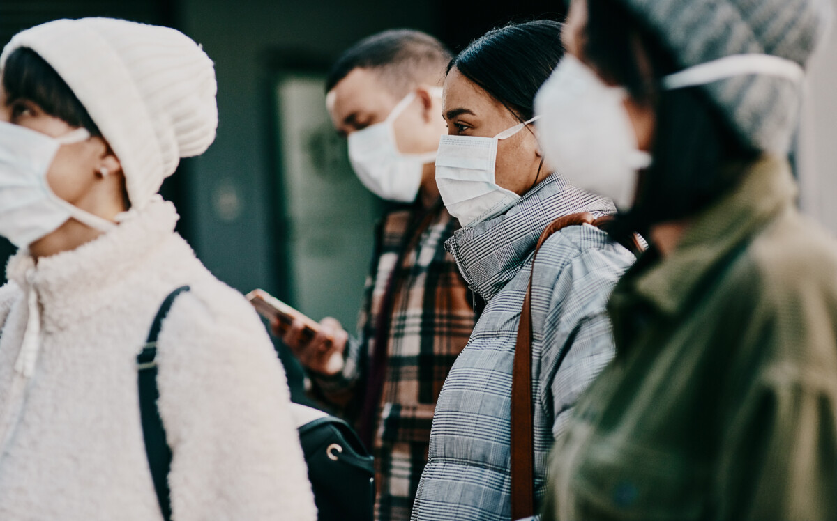 Crowd wearing a facemask while traveling during Covid pandemic