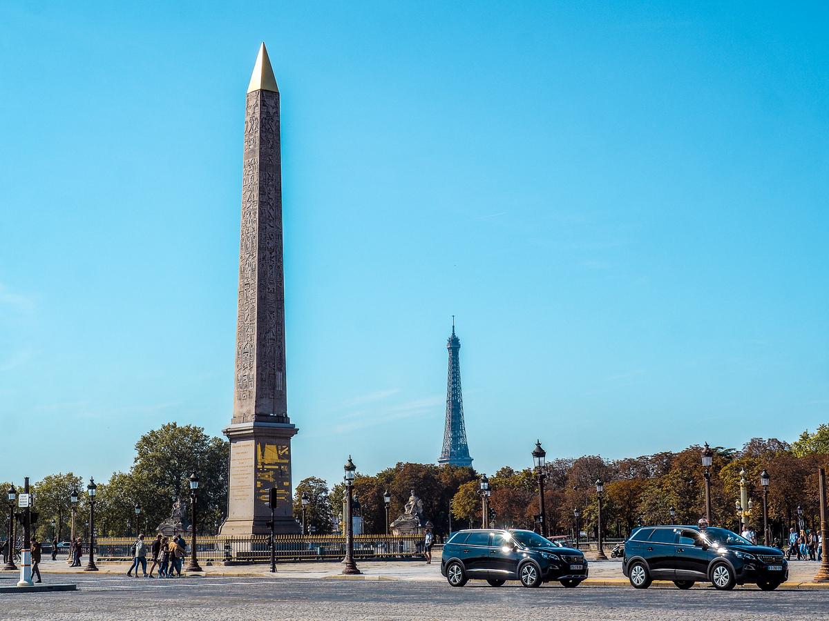 Taxis at Place de la Concorde with Eiffel Tower, Paris