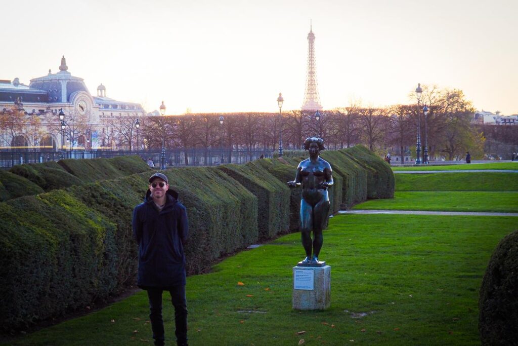 Kyle Kroeger, author, enjoying autumn in Tuileries Garden, Eiffel Tower behind