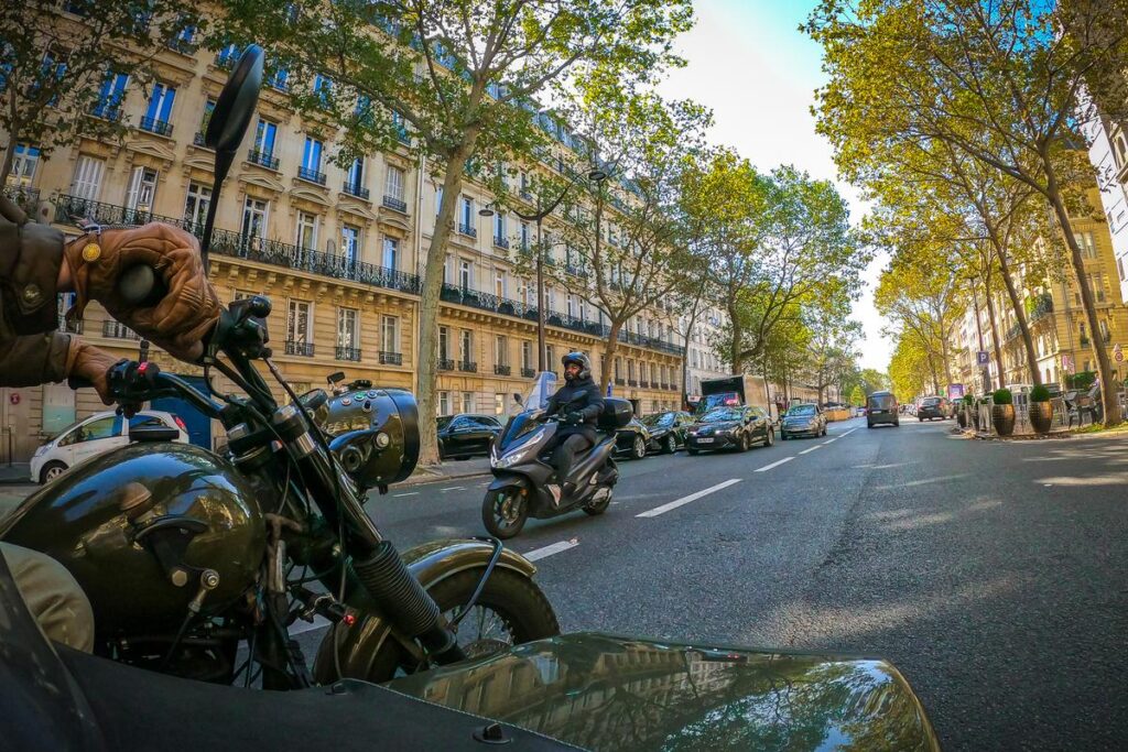 Vintage motorcycle sidecar tour through Paris streets