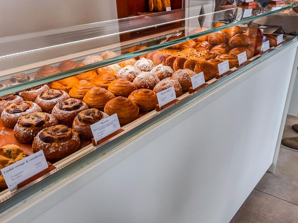 Freshly baked croissants and pastries at a Parisian bakery display